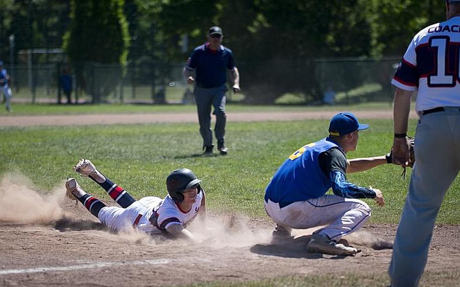 Bitburg's Max Little, left, slides to third before a tag by Sigonella's Ethan Lopez during the DODEA-Europe Division II/III baseball championship at Ramstein Air Base, Germany, on Saturday, May 27, 2017. Bitburg lost the game 10-1.

MICHAEL B. KELLER/STARS AND STRIPES