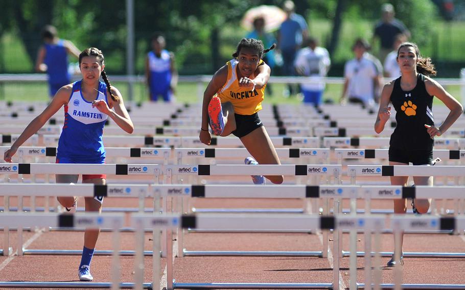 Vicenza's Brandy James, center, on her way to winning the 100-meter hurdles race at the DODEA-Europe track and field finals in Kaiserslautern, Germany, Saturday, May 27, 2017. She won in 15.74 seconds. At left is Ramstein's Sybella Crespo, who was second and Stuttgart's Annika Rivera, who was fifth.