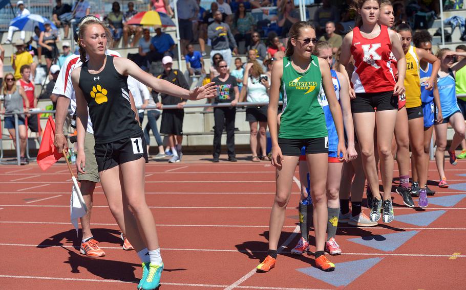 Stuttgart anchor Abigail Braa waits for teammate Anna Riley to run the last leg of the 3200-meter relay at the DODEA-Europe track and field finals in Kaiserslautern, Germany, Saturday, May 27, 2017. Along with teammates Anja Meier and Katie McLellan they took the title in 10 minutes, 20.16 seconds ahead of Ramstein and SHAPE.