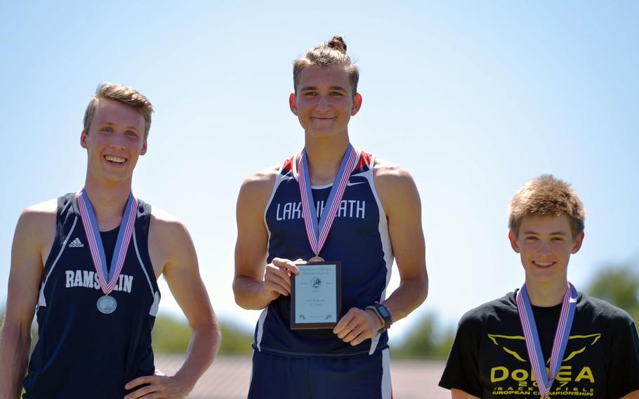 Lakenheath's Austin Burt, center, won the 1600-meter race at the DODEA-Europe track and field finals in Kaiserslautern, Germany, Saturday, in a new DODEA-Europe record of 4 minutes, 24.18 seconds. Ramstein's Colin McLaren's 4:24.86 also would have beat the old record. At right is Black Forest Academy's MacRoberts, who took third.