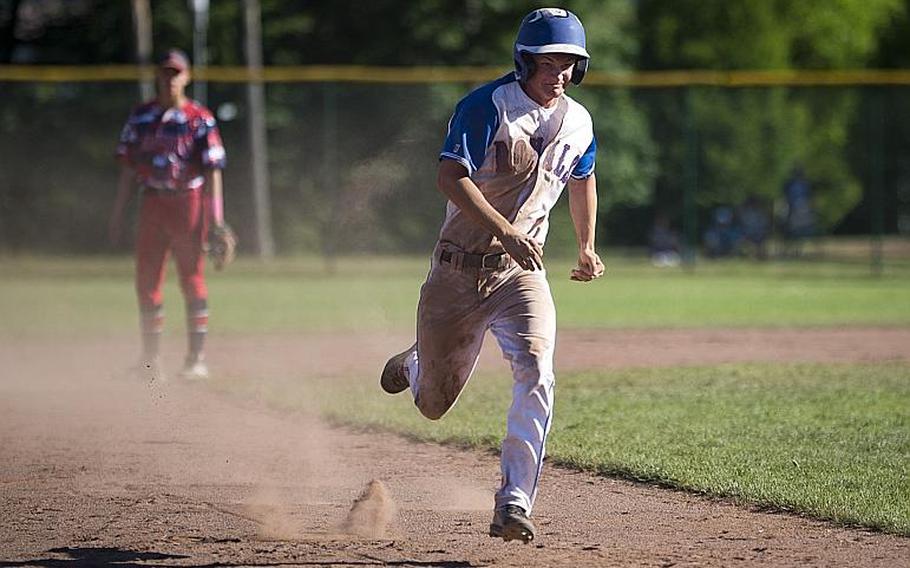 Ramstein's Reed Marshall runs to third during the DODEA-Europe Division I baseball championship at Ramstein Air Base, Germany, on Saturday, May 27, 2017. Ramstein won the title game against Lakenheath 8-6.

MICHAEL B. KELLER/STARS AND STRIPES