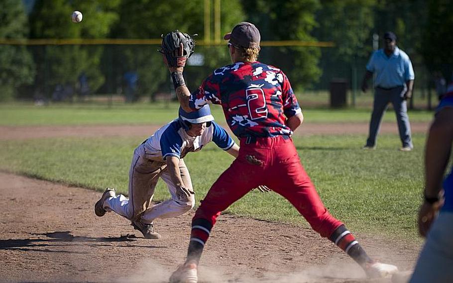 Ramstein's Reed Marshall dives to third under a throw to Lakenheath's Kaiden Morales during the DODEA-Europe Division I baseball championship at Ramstein Air Base, Germany, on Saturday, May 27, 2017. Ramstein won the game 8-6.

MICHAEL B. KELLER/STARS AND STRIPES