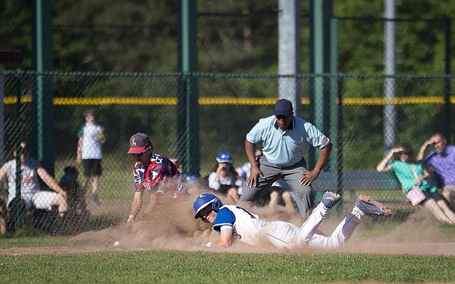 Ramstein's Tieran Shoffner, right, slides to third ahead of a tag by Lakenheath's Kaiden Morales during the DODEA-Europe Division I baseball championship at Ramstein Air Base, Germany, on Saturday, May 27, 2017. Ramstein won the game 8-6.

MICHAEL B. KELLER/STARS AND STRIPES
