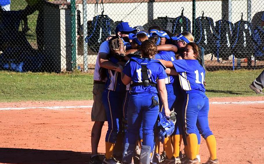 The Sigonella softball team gathers on field after a championship game win against Bitburg at Ramstein Air Base,  Germany on Saturday, May 27.