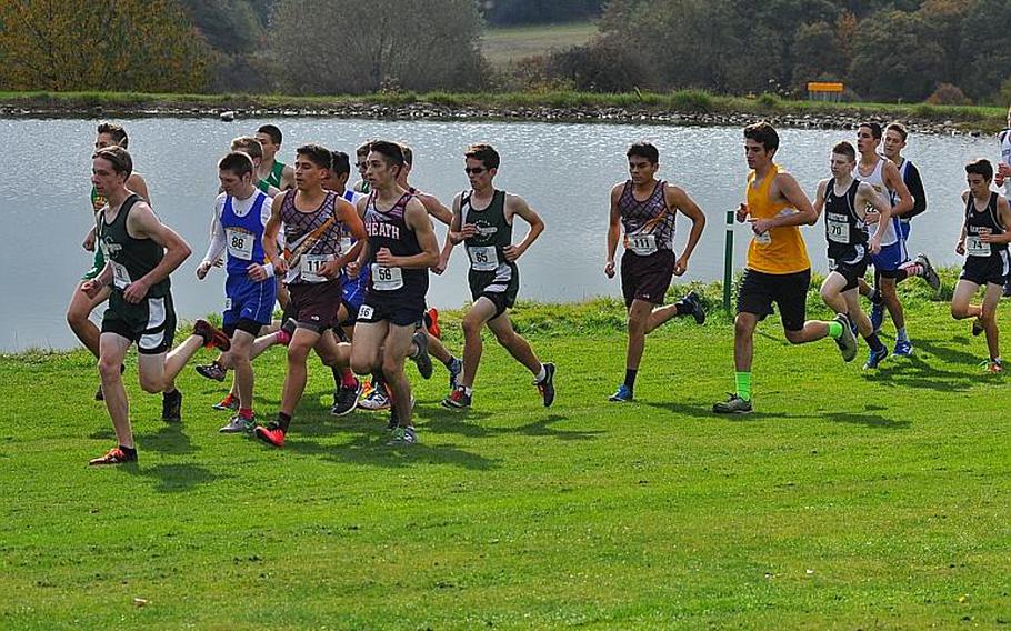 A pack of runners race past a small pond on the Baumholder Army Golf Course on Saturday. The runners were competing in the 2016 DODEA European cross country championships in Baumholder, Germany.