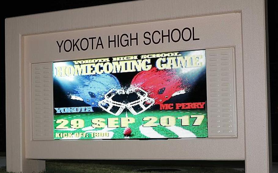 The marquee in front of the new Yokota High School touts the homecoming football game Friday against Matthew C. Perry. The visiting and defending Far East Division II champion Samurai have to travel between 11 and 13 hours, sometimes longer, from Marine Corps Air Station Iwakuni by bus to Yokota, which can sometimes be an undertaking.