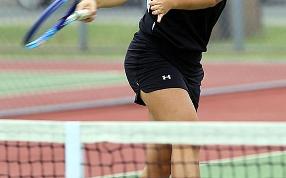 Two ways people at Zama can tell No. 1 tennis singles player Megan Petros apart from her senior twin Marissa ... is to look for the orange shoes and the blue-rimmed racket.