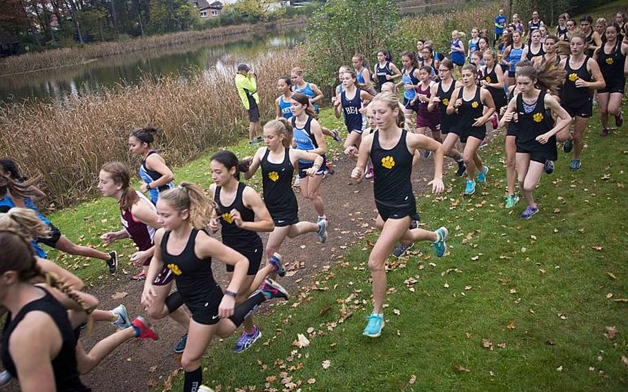 Runners take off from the starting line during a cross country meet in Ramstein-Miesenbach, Germany, on Saturday, Oct. 21, 2017.