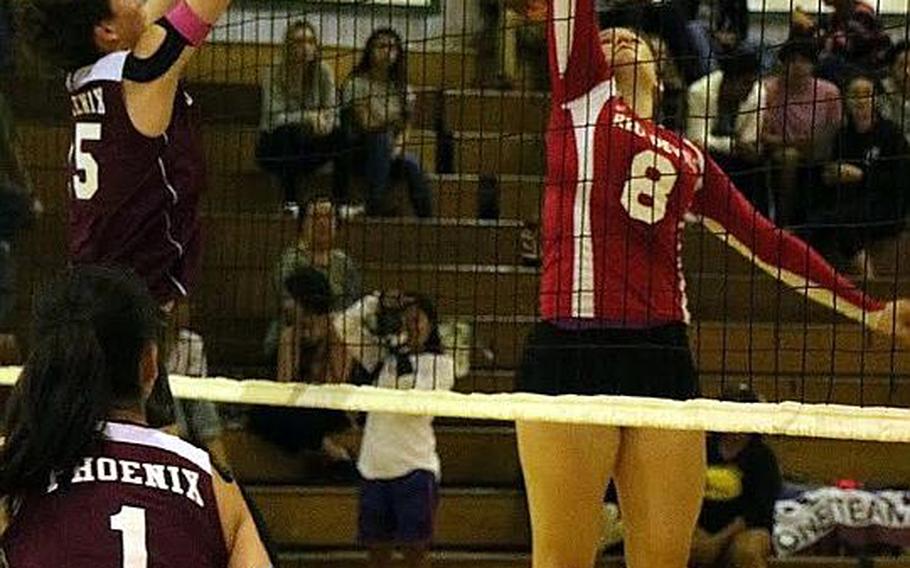 Nile C. Kinnick's Faith Hughes tries to tip the ball past Seisen's Amanda Wood.