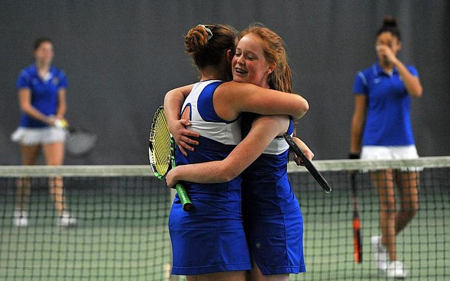 Megan Stretch, right, hugs teammate Amanda Daly after the Ramstein doubles team defeated Wiesbaden's Shelby Albers and Melissa Pritchett 6-2, 6-1 to take the title at the DODEA-Europe tennis championships in Wiesbaden, Germany, Saturday, Oct. 28, 2017.