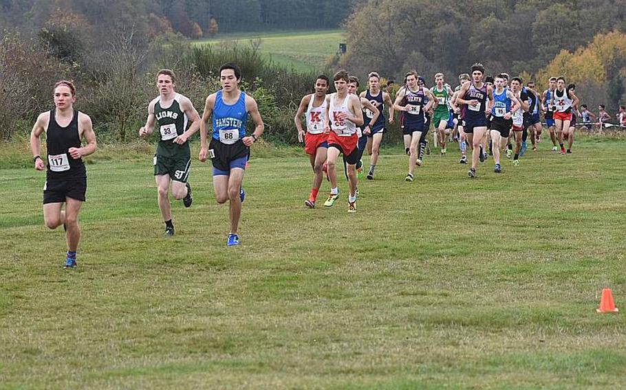 Runners start to spread out in the first mile of the boys' race in the DODEA European cross country championships on Saturday, Oct. 28, 2017, in Baumholder, Germany, including Stuttgart's Paul Fullwood, in black, Ramstein's Jose Serrano and St. John's Isaiah Lowney.