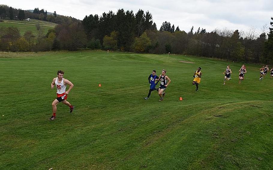 A Kaiserslautern runner looks over his shoulder during the boys' race in the DODEA European cross country championships on Saturday, Oct. 28, 2017, in Baumholder, Germany.