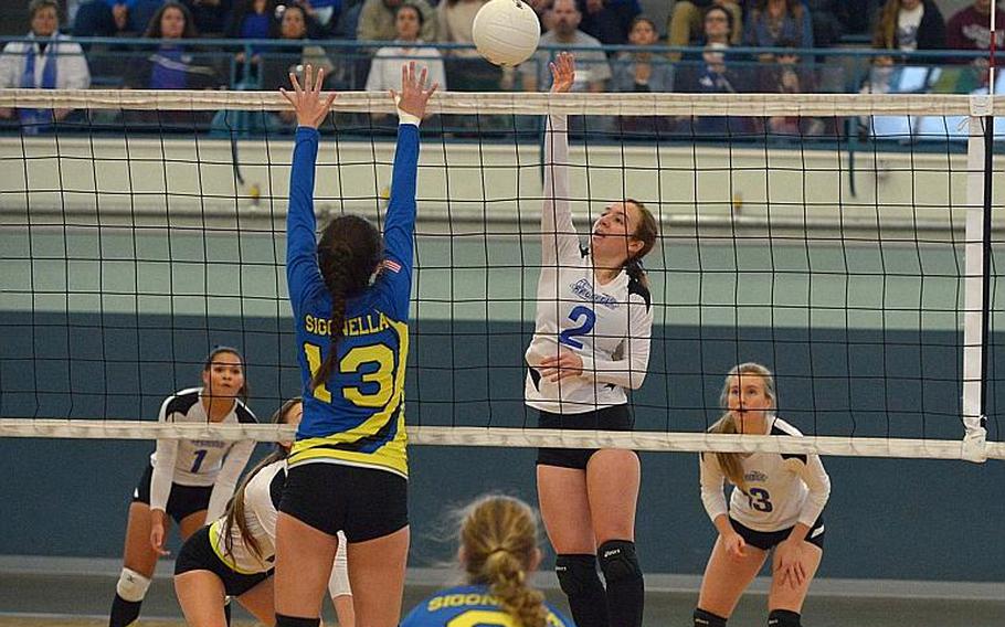 Brussels' Caitlin McCollom knocks the ball over the net against Sigonella's Kristiana Wyrick in the Division III championship game at the DODEA-Europe volleyball finals in Kaiserslautern, Germany, Saturday, Nov.4, 2017. Sigonella won 25-17, 21-25, 25-17, 25-22.