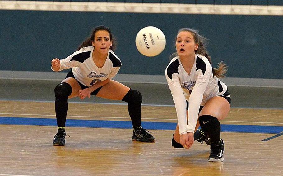Brussels' Olivia Friedhoff digs deep to get a Sigonella serve as teammate Sophia Beckley watches. Sigonella beat Brussels 25-17, 21-25, 25-17, 25-22 to take the Division III title at the DODEA-Europe volleyball finals in Kaiserslautern, Germany, Saturday, Nov.4, 2017. 

Michael Abrams/Stars and Stripes