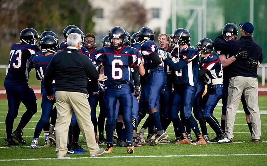The Spangdahlem Sentinels celebrate winning the DODEA-Europe Division II championship at Vogelweh, Germany, on Saturday, Nov. 4, 2017. Spangdahlem defeated Rota 36-19 to win the title.