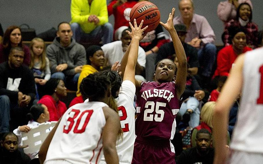 Vilseck's Tynniesia Wilson shoots over Kaiserslautern's Alicia Alamos at Vogelweh, Germany, on Friday, Dec. 1, 2017. Vilseck won the game 30-24