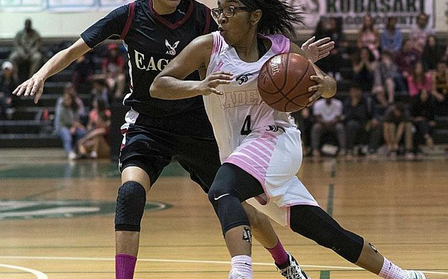 MVP going against MVP in last year's Far East Girls Division I Tournament final at Kubasaki. Kadena's Rhamsey Wyche dribbles against American School of Bangkok's Shainque Lucas during the Eagles' 52-31 win over the Panthers.