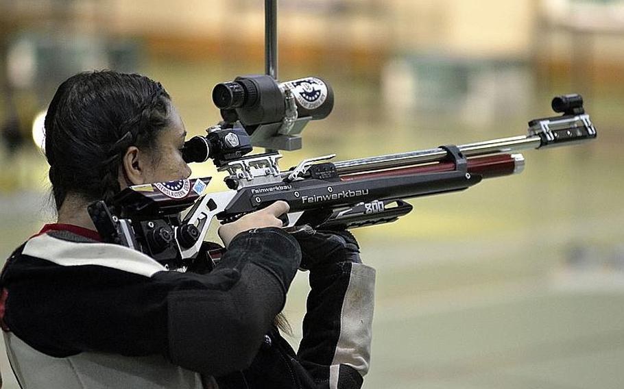 Kaiserslautern third-year shooter Victoria Jackson fires in her unique standing positon at a 10-meter target during a high school marksmanship match at RAF Alconbury, England, Saturday, December 9, 2017. Jackson took second in the match with a combined score of 282-7.