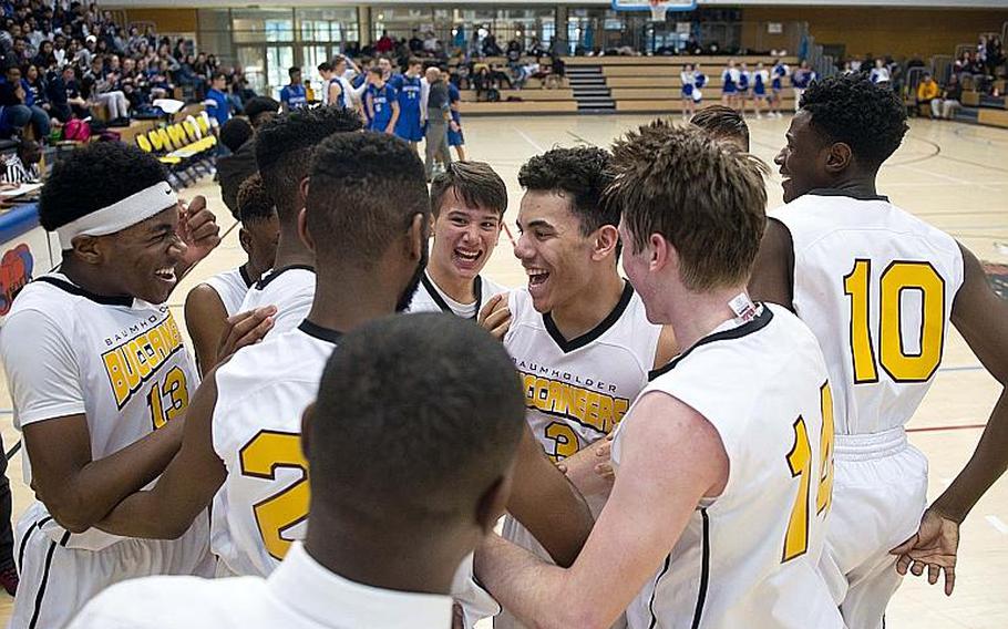 Baumholder celebrates winning the DODEA-Europe Division III championship in Wiesbaden, Germany, on Saturday, Feb. 24, 2018. Baumholder defeated Brussels 35-28 in overtime to win the title.