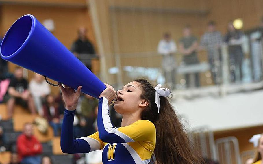 Wiesbaden sophomore Erika Chavez cheers with a megaphone during the DODEA-Europe cheer tournament on Saturday, Feb. 24, 2018, in Wiesbaden, Germany.