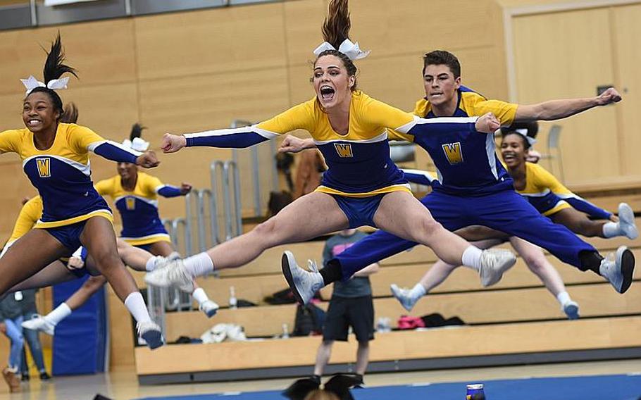 Wiesbaden cheerleaders do splits in the air during the DODEA-Europe cheer tournament on Saturday, Feb. 24, 2018, in Wiesbaden, Germany.