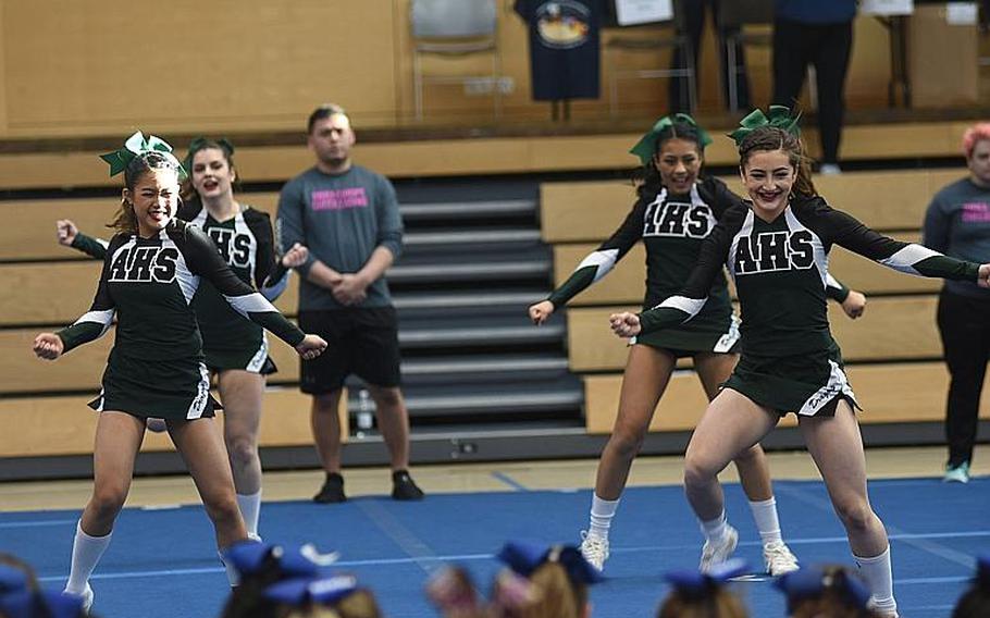 Alconbury cheerleaders look like they're having fun at the DODEA-Europe cheer tournament on Saturday, Feb. 24, 2018, in Wiesbaden, Germany. The Dragons took first place in Division III.