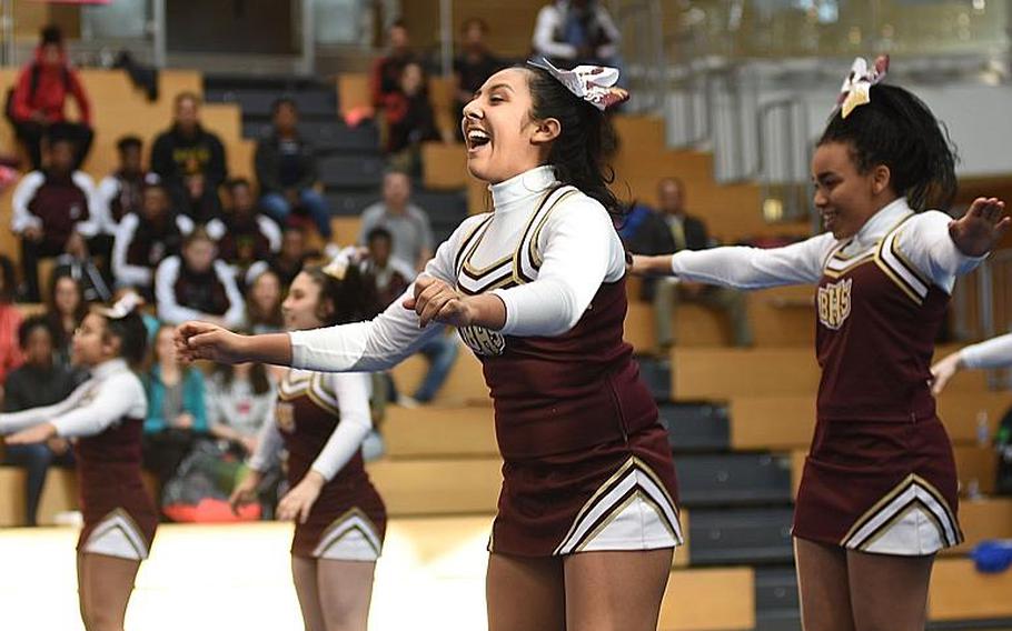 Baumholder cheerleaders laugh and smile during the DODEA-Europe cheer tournanment on Saturday, Feb. 24, 2018, in Wiesbaden, Germany. Baumholder finished second in Division III.