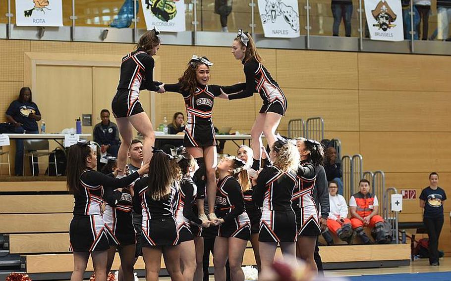 Spangdahlem cheerleaders work to complete a pyramid at the DODEA-Europe cheer tournament on Saturday, Feb. 24, 2018, in Wiesbaden, Germany. The Sentinels took second place in Division II during their first year at their new school, after Bitburg closed last year.