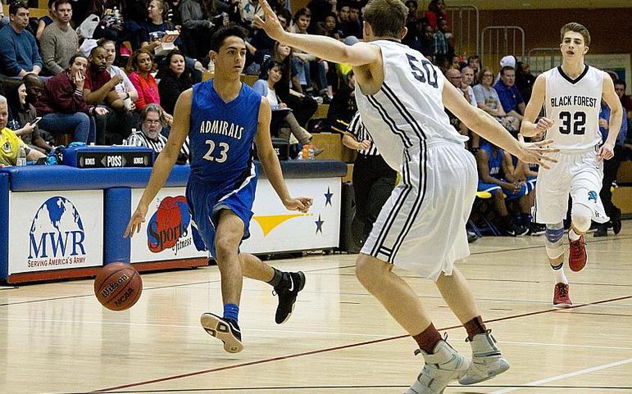 Rota's Joseph Perches, left, tries to get past Black Forest Academy's Kaden Proctor during the DODEA-Europe Division II championship in Wiesbaden, Germany, on Saturday, Feb. 24, 2018. Rota lost 48-47.