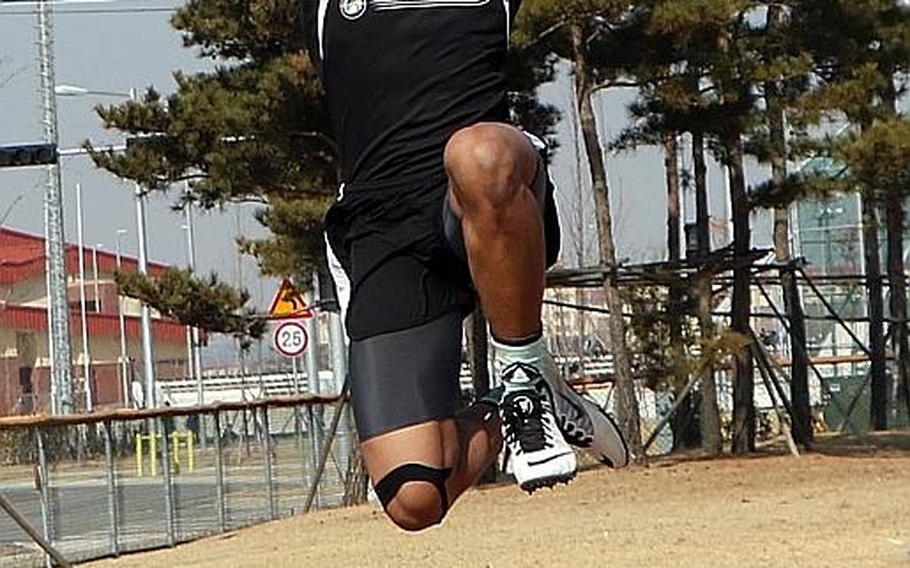 Humphreys' Jaylan Horne, performing the long jump, is one of six boys athletes returning to a Blackhawks team that won the first Far East banner in school history last May.
