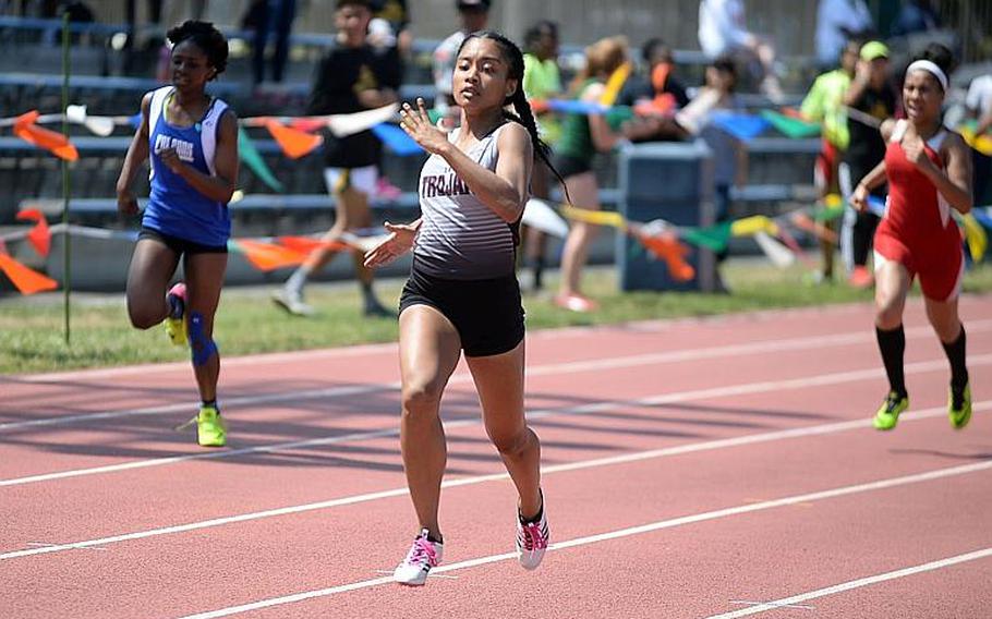 Faith Bryant, center, is the lone returner from Zama's foursome that set a northwest Pacific record in the 400 relay during last May's Far East meet.