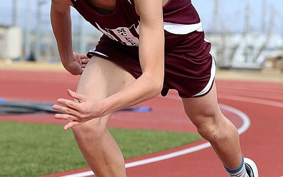 Sprinter Isaiah Kim comes out of the blocks during first-year track program Matthew C. Perry practice.