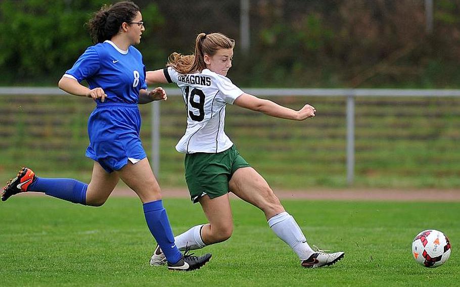 Alconbury's Laela Evans scores a goal as Brussels' Ece Kilinc tries to defend. Alconbury beat Brussels 3-1 in Division III action at the DODEA-Europe soccer championships in Landstuhl, Germany.