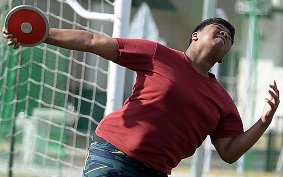 Matthew C. Perry sophomore thrower Will Dearinge launches the discus during practice.