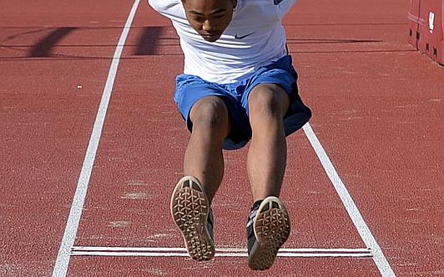 Matthew C. Perry freshman Sean Swindell goes through his long-jump paces.