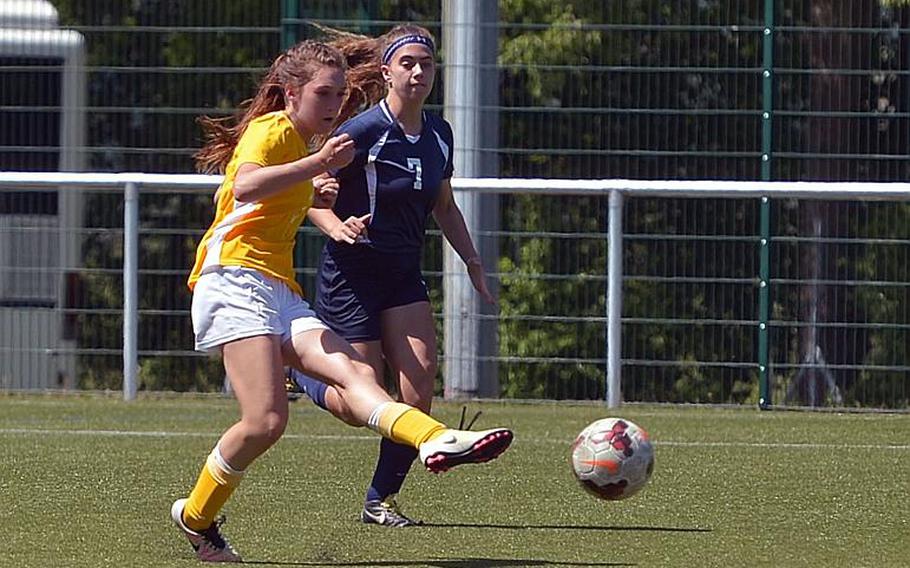 Stuttgart's Emily Smith takes a shot against Lakenheath at last year's DODEA-Europe soccer championships in Reichenbach, Germany, as the Lancers' Siera Karnes defends.

Michael Abrams/Stars and Stripes