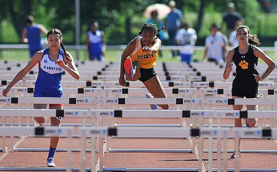 Vicenza's Brandy James, center, on her way to winning the 100-meter hurdles race at the DODEA-Europe track and field finals in Kaiserslautern, Germany, Saturday, May 27, 2017. She won in 15.74 seconds. At left is Ramstein's Sybella Crespo, who was second and Stuttgart's Annika Rivera, who was fifth.




Michael Abrams/Stars and Stripes