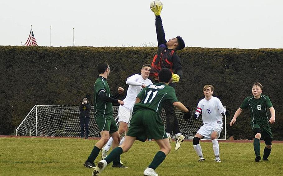 Alconbury???s Dee Wilson defends the goal against Brussels during a high school varsity soccer game at RAF Alconbury, England, Saturday, March 24, 2018. Wilson had 15 saves in the 1-0 loss against the Brigands.