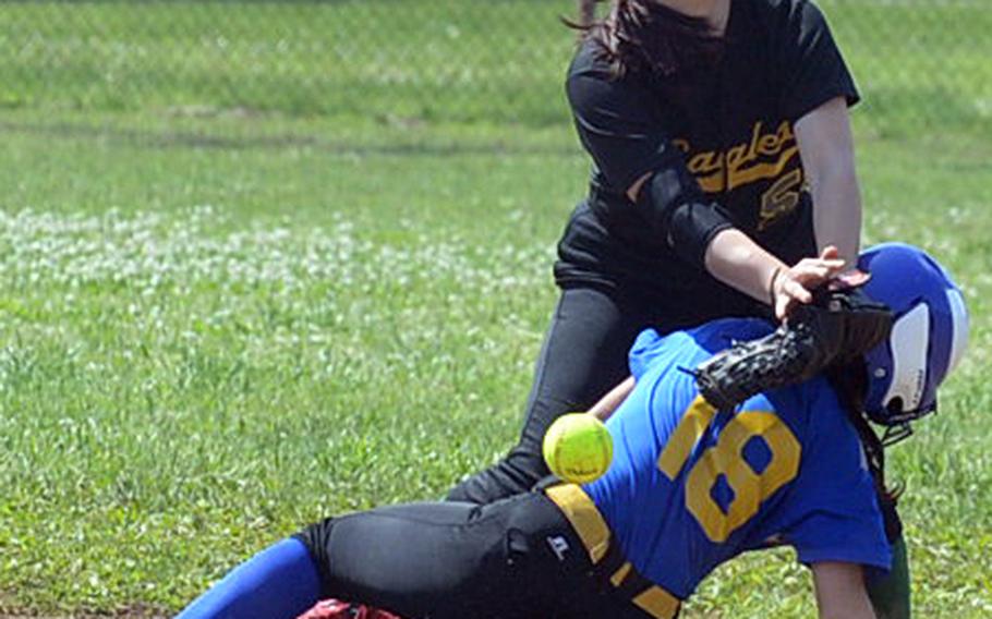 Yokota's Annalise Rodriguez slides safely into second base as Robert D. Edgren shortstop Veronica Crawford can't find the handle on the ball during Saturday's DODEA Japan softball tournament finals. The Eagles rallied past the Panthers 13-12 to win the tournament for the first time in school history.