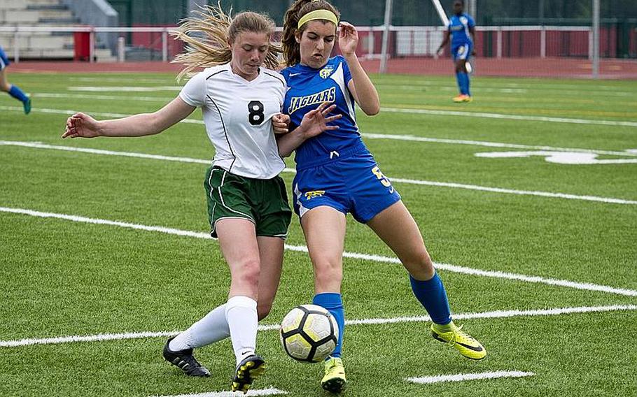Alconbury's Haley Starr, left, and Sigonella's Alex Garcia challenge each other for the ball during the DODEA-Europe Division III soccer championship in Kaiserslautern, Germany, on Thursday, May 24, 2018. Alconbury won the game 1-0.