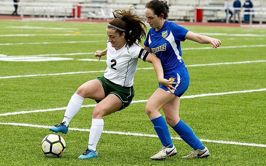 Alconbury's Isabel Black, left, tries to dribble past Sigonella's Cecelia Warren during the DODEA-Europe Division III soccer championship in Kaiserslautern, Germany, on Thursday, May 24, 2018.