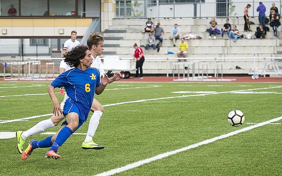 Ansbach's Giancarlo Solito, left, and Brussels' Noah Gray race for the ball during the DODEA-Europe Division III soccer championship in Kaiserslautern, Germany, on Thursday, May 24, 2018. Brussels won the game 7-0.
