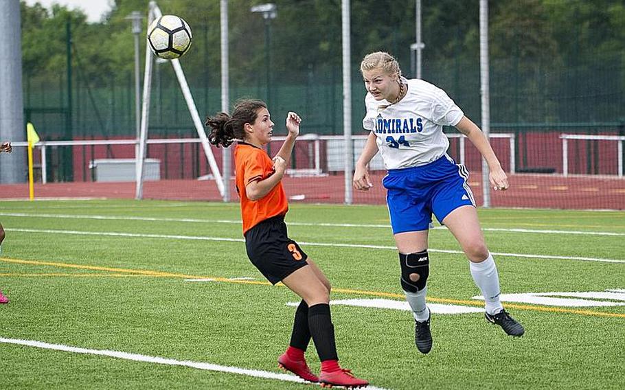 Rota's Jacqueline Holtz, right, heads the ball over Spangdhalem's Emma Passig during the DODEA-Europe Division II soccer championship in Kaiserslautern, Germany, on Thursday, May 24, 2018.