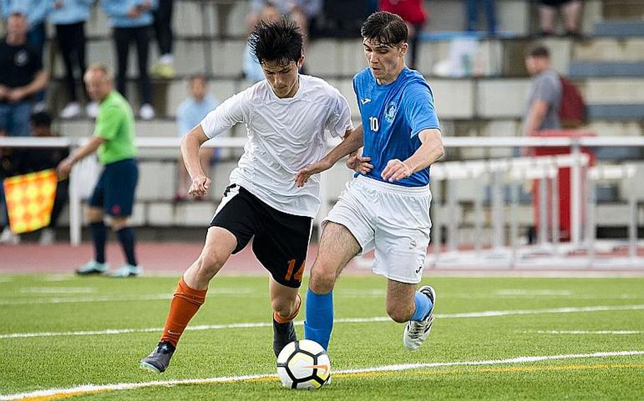 Marymount's Alexander Herne, right, and AFNORTH's James Barata battle for the ball during the DODEA-Europe Division II soccer championship in Kaiserslautern, Germany, on Thursday, May 24, 2018.
