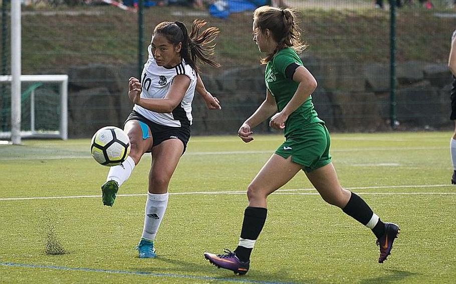 Stuttgart's Camille Pereira, left, clears the ball past Naples' Cora Houseworth during the DODEA-Europe soccer championships in Reichenbach, Germany, on Wednesday, May 23, 2018.