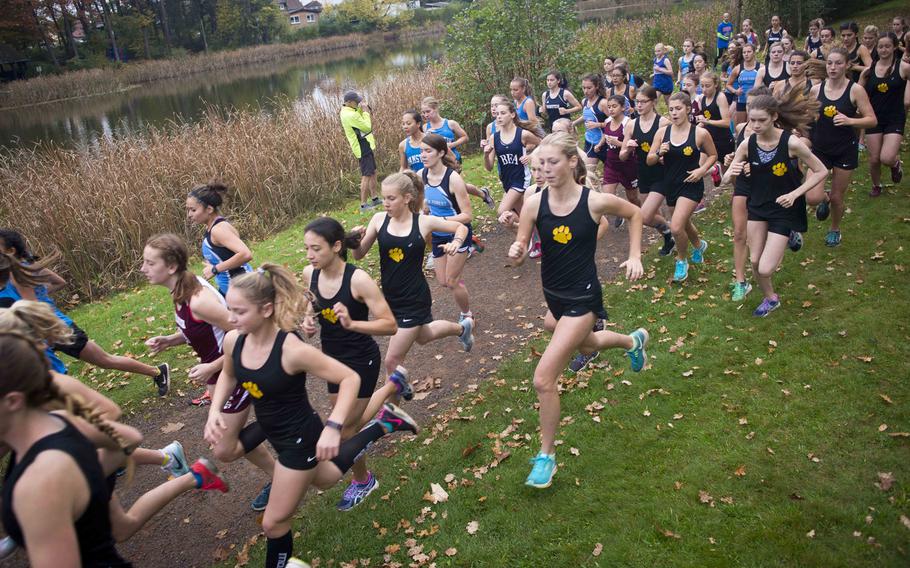 Runners take off from the starting line during a cross country meet in Ramstein-Miesenbach, Germany, on Saturday, Oct. 21, 2017. 