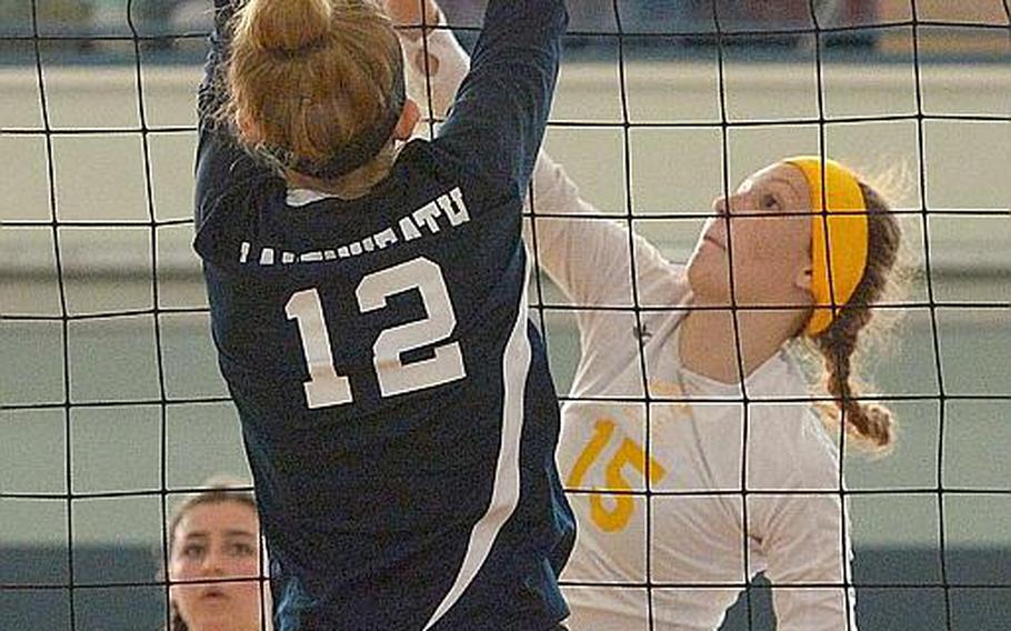 Stuttgart's Geneva Barriger gets the ball past the block by Lakenheath's Jayden Thormann in the Division I title game at the DODEA-Europe volleyball finals in Kaiserslautern, Germany, Saturday, Nov.4, 2017. Lakenheath defeated Stuttgart 25-23, 25-23, 25-20.