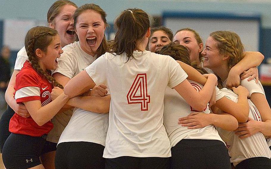 American Overseas School of Rome players celebrate their Division II title at the DODEA-Europe volleyball finals in Kaiserslautern, Germany, Saturday, Nov.4, 2017. They beat Bahrain 24-26, 25-20, 25-19, 25-22.