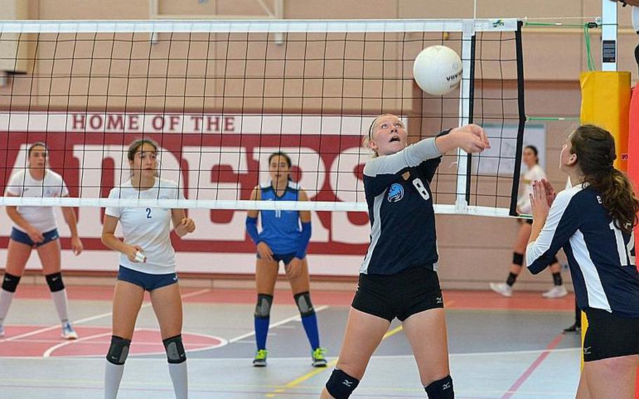 Black Forest Academy's Liz McKell hits the ball back over the net as teammate Brianne Maier watches. Marymount took the Division II DODEA-Europe volleyball title with a 24-26, 25-18, 25-21, 25-13 win over BFA.