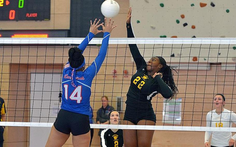 Ramstein's Shemilia Johnson and Stuttgart's Skye DeSilva Mathis battle at the net in the Division I final at the DODEA-Europe volleyball championships in Kaiserslautern, Germany. Stuttgart took the title with a 25-23, 25-18, 25-10 win over the Royals.